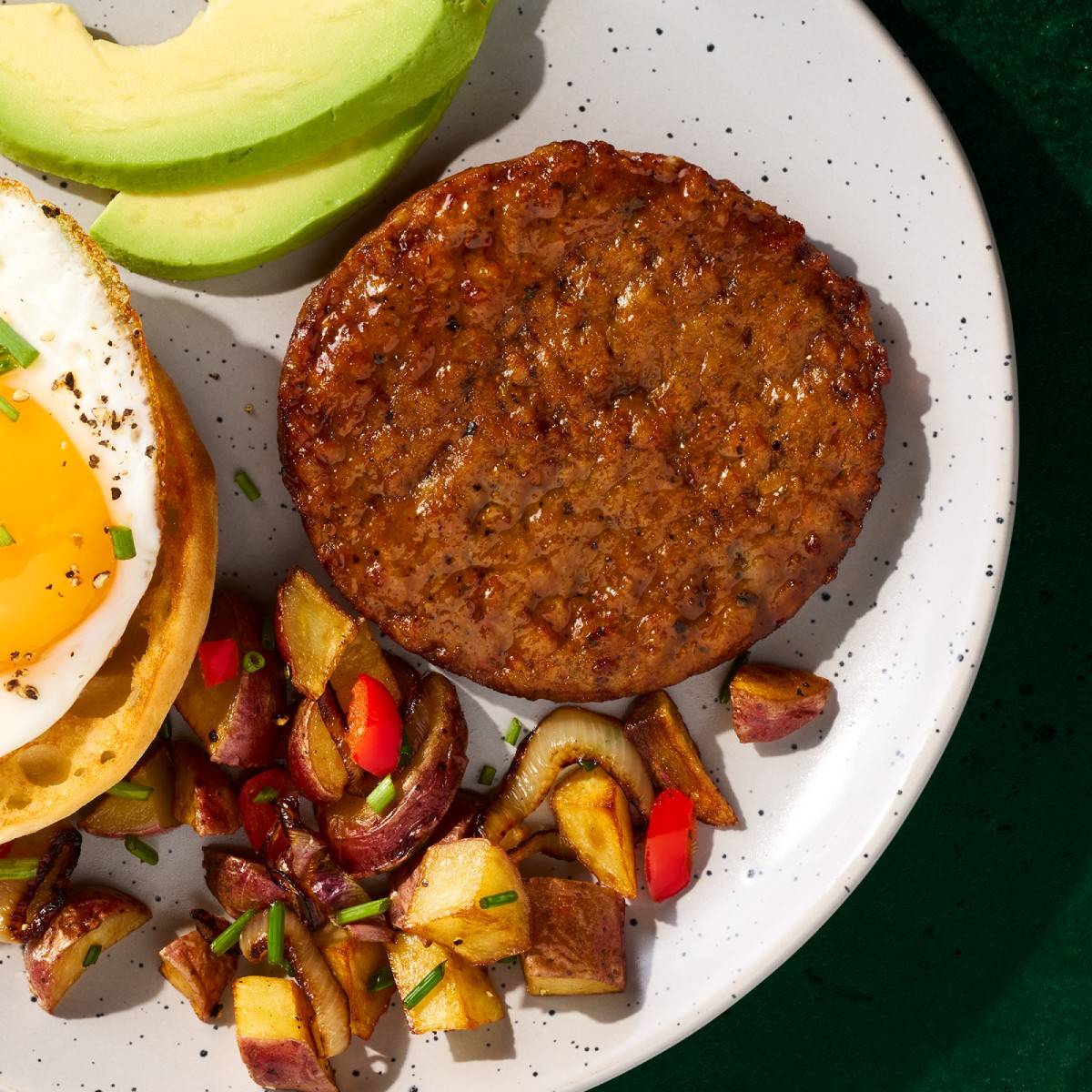 Jumbo sausage patties on a plate.