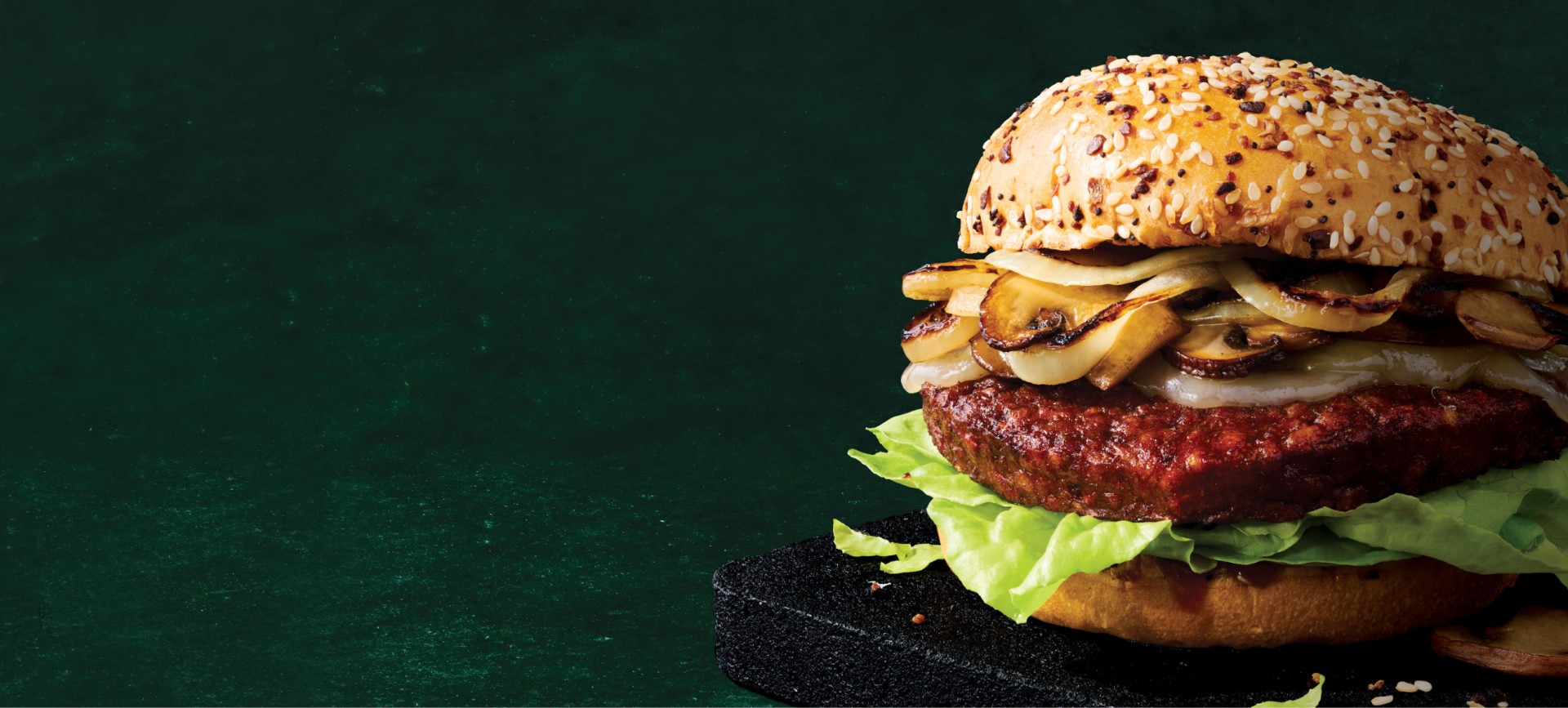 vegetarian patty melt on a green granite background